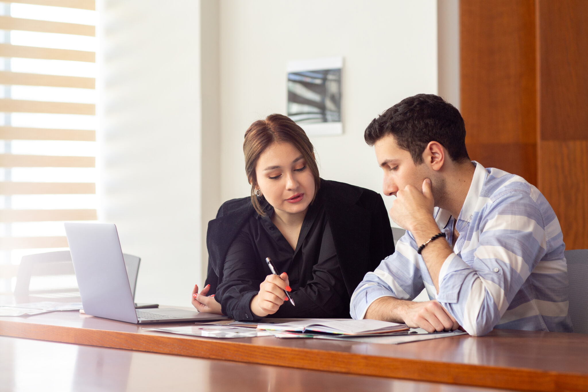 front-view-young-beautiful-businesswoman-black-shirt-black-jacket-along-with-young-man-discussing-work-issues-inside-her-office-work-job-building